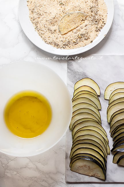 come fare le melanzane gratinate - Ricetta di Tavolartegusto